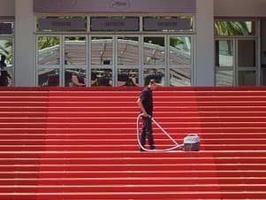 man cleaning carpet